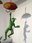 Ancizar Marin Sculptures  Ancizar Marin Sculptures  Umbrella with Jester (Rainbow Umbrella, Forest Green Figure)